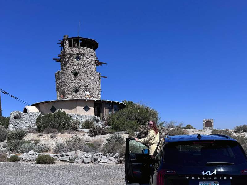 Woman getting out of her vehicle at the Desert View Tower in Arizona.