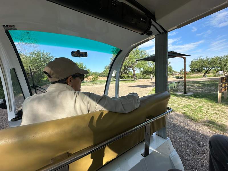 A park guide drives an electric tram for visitors in Bentsen-Rio Grand Valley State Park