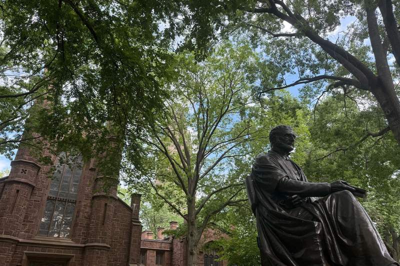 Yale campus with statue and buildings in background