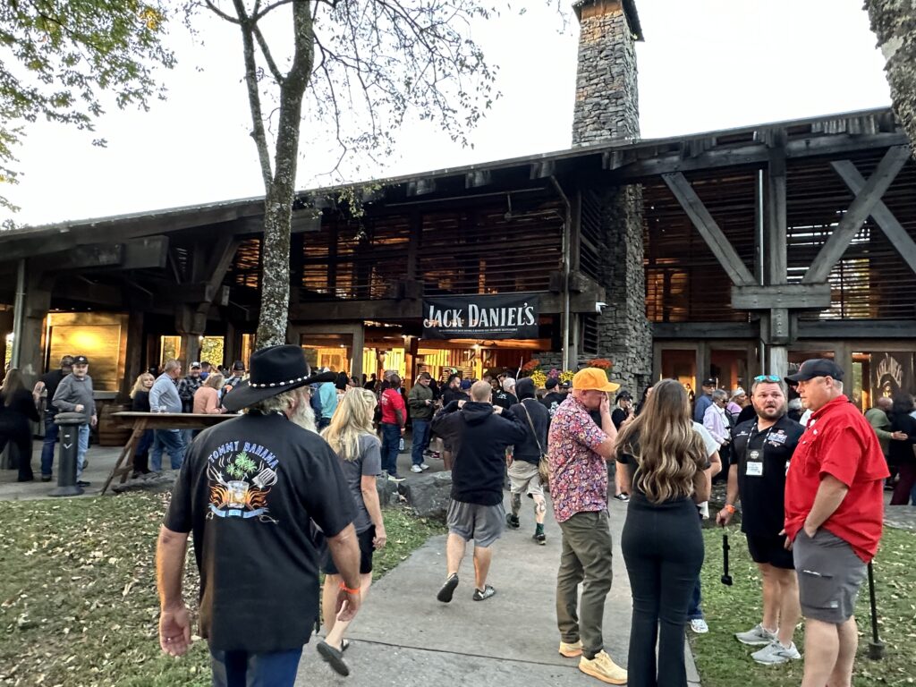 The crowd at the Jack Daniel's World Championship Barbecue Invitational in Lynchburg. Photo credit Robin O'Neal Smith A pavilion with a Jack Daniel's banner and a crowd of people.