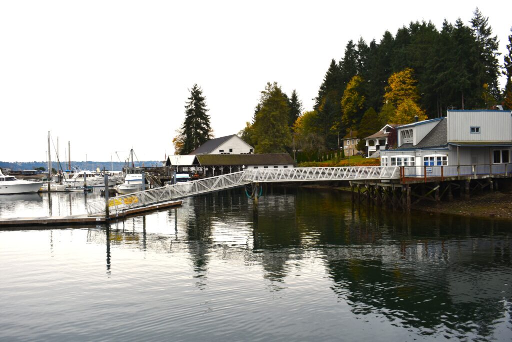 Waterfront restaurant with floating dock surrounded by Fall foliage