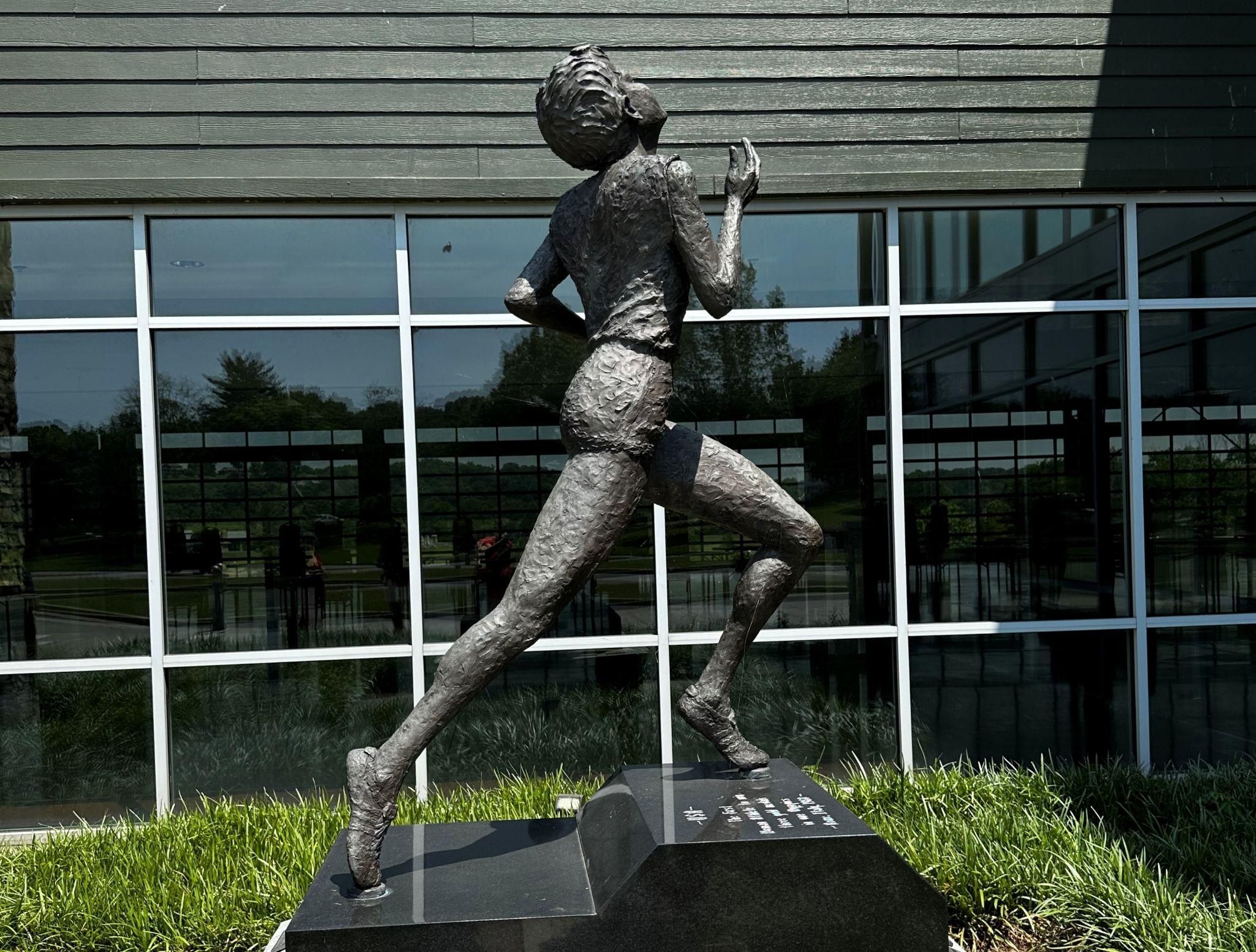 A statue of a woman running.