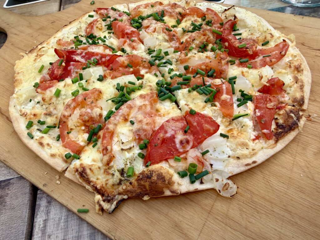 Flammkuchen, a pizza-like pie topped with onions, tomatoes and chives