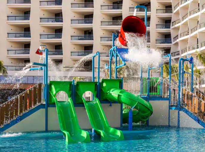 Pool with water slides at Hilton Cancun All-Inclusive Resort