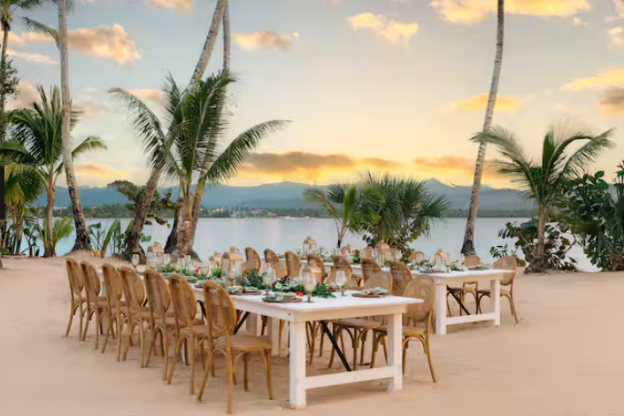 Tabels set for a fancy dinner on the beach at Zemi Miches Punta Cana, a Hilton all-inclusive resort