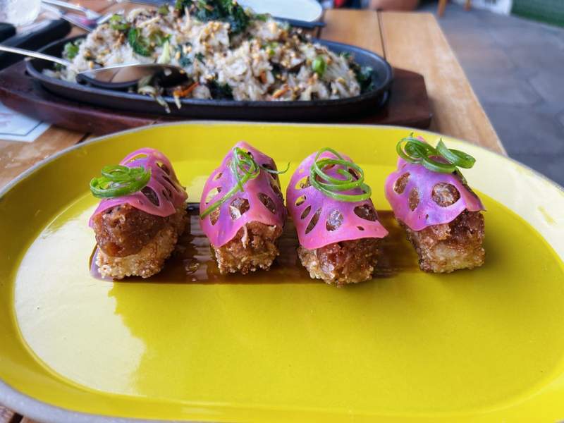 Smashed Cripsy Fingerling Potatoes served at Tigress. garnished with scallions