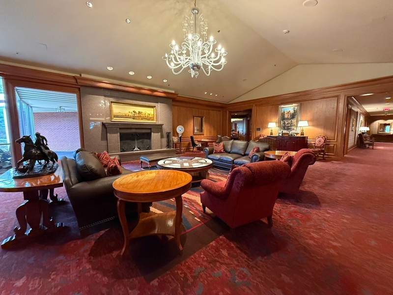 Comfortable lobby seating at Little America Hotel in Cheyenne surrounded by warm wood finishes and Western motifs.