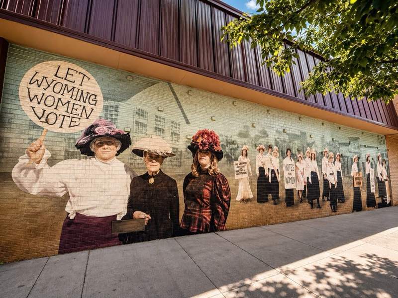 Downtown Cheyenne mural depicting historic women suffragists and Wyoming’s early role in women’s voting rights.