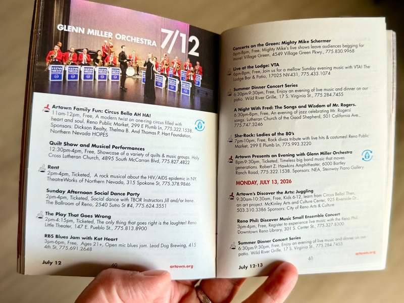 Hand holding an Artown Little book open to the spread for 7/12/26 events and venues.