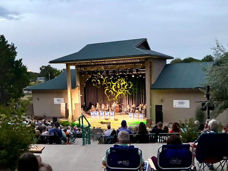 Glenn Miller Orchestra performing in an outdoor amphitheater with audience in foreground as part of the Reno Artown Festival.
