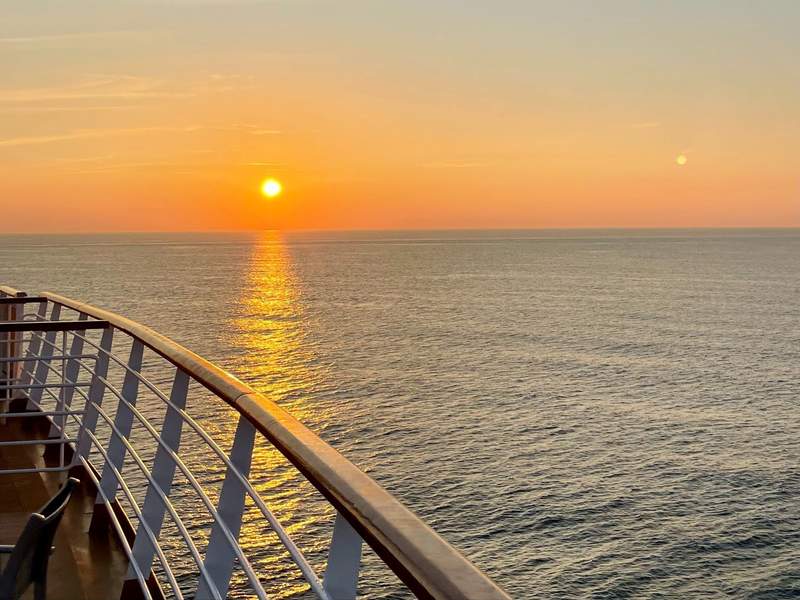 Sunset over the ocean from the deck of a Holland America cruise ship