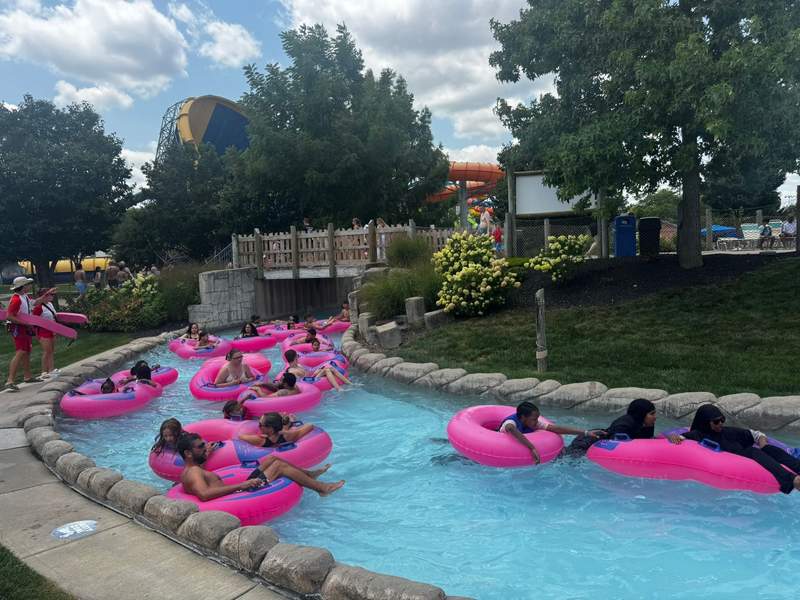 Guests relax on inner tubes as they float through the lazy river at Zoombezi Bay water park.