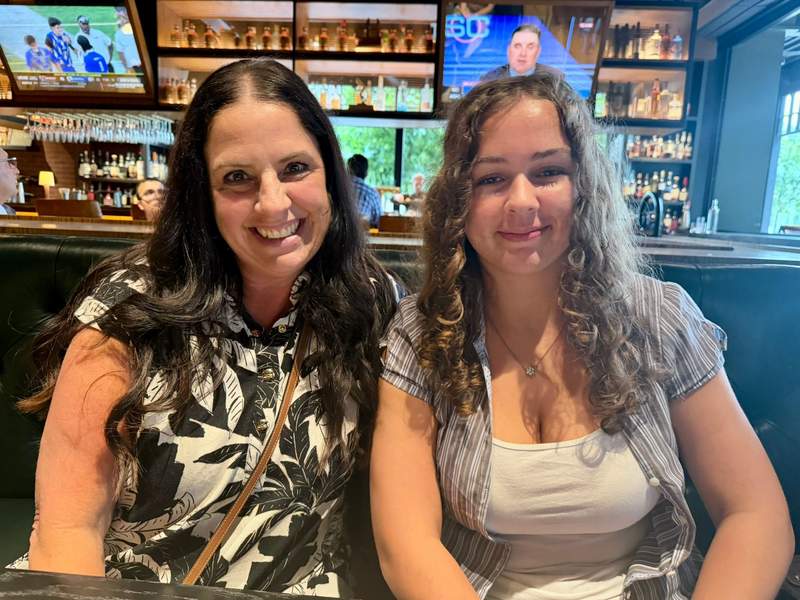 Mother and daughter enjoying dinner together at Little West Tavern in Columbus.