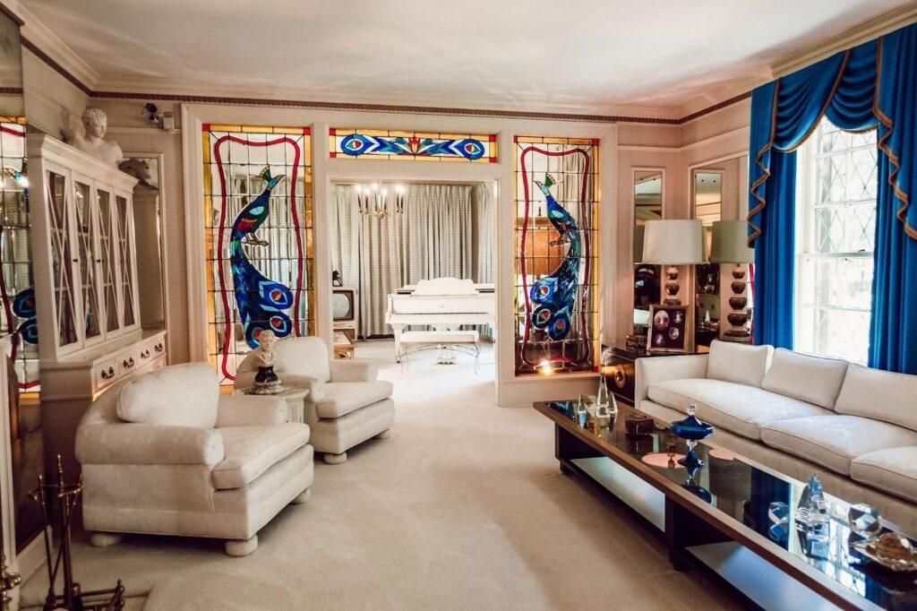 Elvis Presley's blue and white living room with stained glass accents