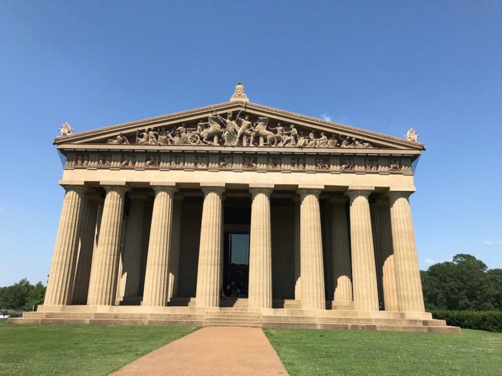 Full-scale replica of the Parthenon structure set against blue sky in Nashville