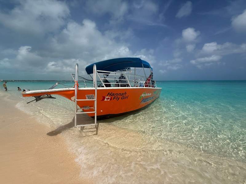 A boat pulled up to the beach at Grace Bay, Turks and Caicos