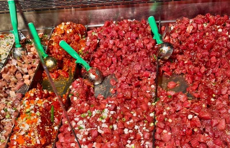 Trays of glossy ruby-red ahi poke fill Foodland’s seafood counter, mixed with green onion, sesame and a variety of seasonings.