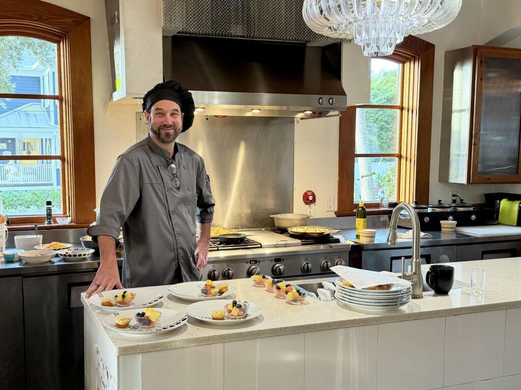 Chef in open kitchen prepping complimentary breakfast at the Black Dolphin Inn in New Smyrna Beach