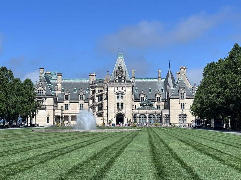 Historic Biltmore mansion surrounded by expansive gardens and landscaped grounds in Asheville, North Carolina