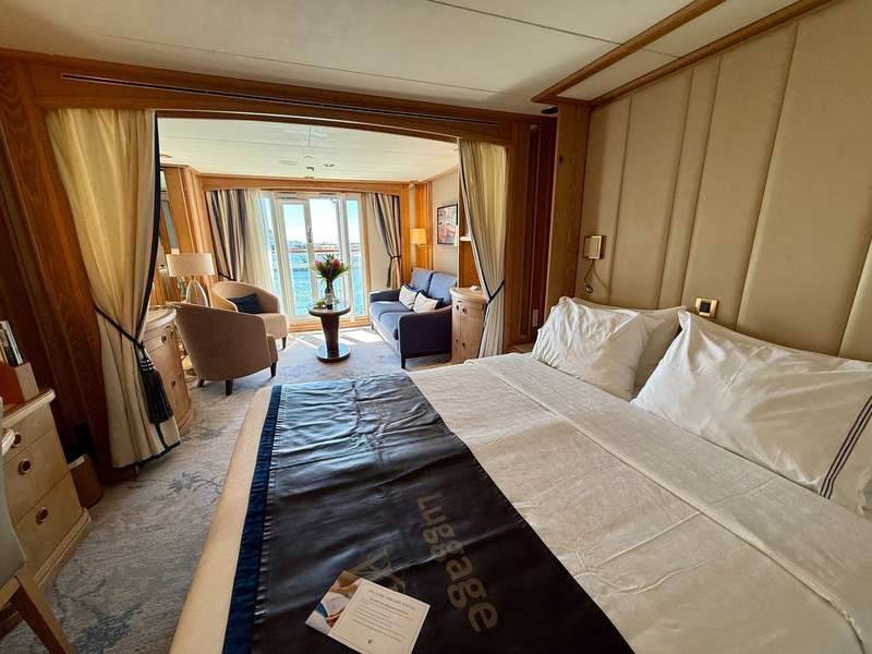 View of nice cabin on cruise ship with Tahiti visible through window