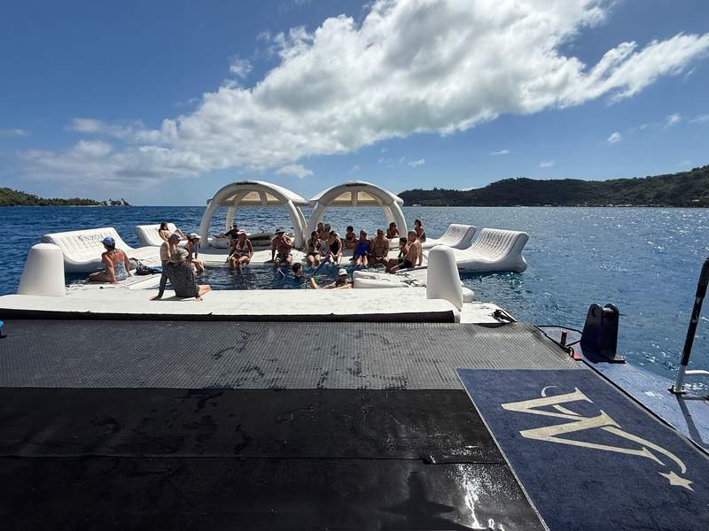 The water sports platform at the aft of the Windstar Star Breeze with a tropical island poking up in the distance.