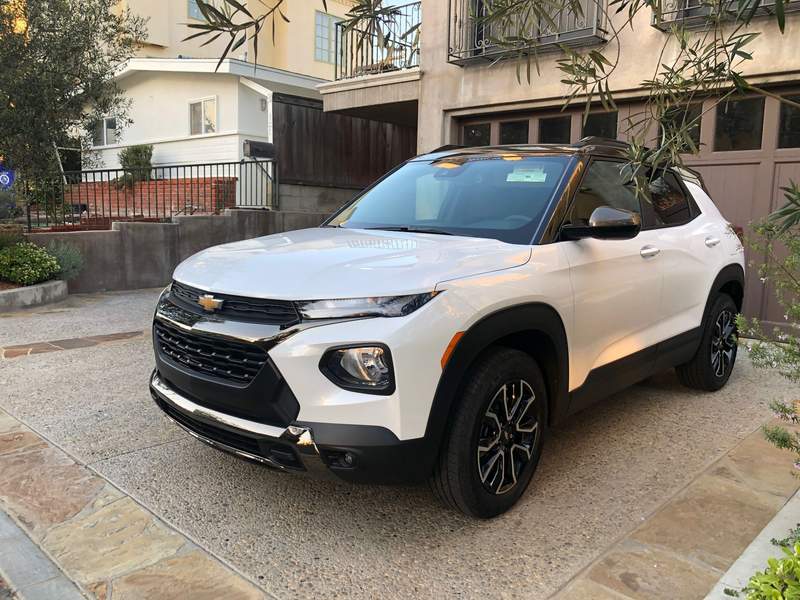 white chevy SUV parked in a driveway