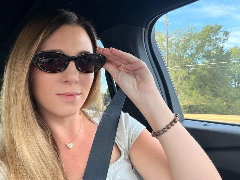 Woman in a car wearing Meta Starfire Kylie Edition glasses