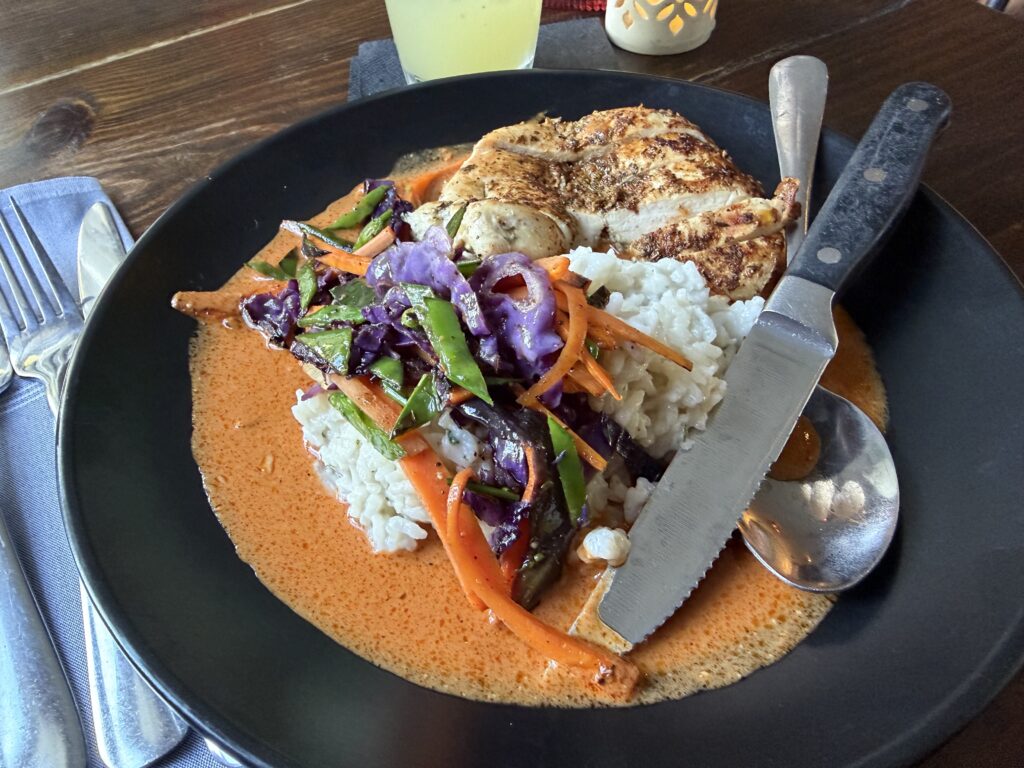 Red curry and mango chutney with grilled chicken served at Riverpark Terrace in New Smyrna Beach, Florida