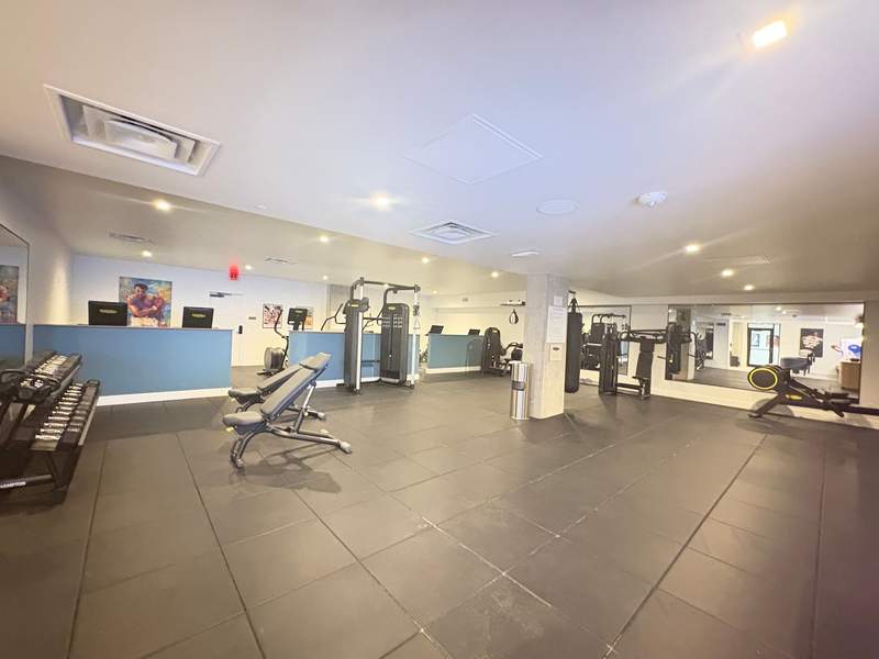 hotel gym with weight machines, free weights and cardio equipment