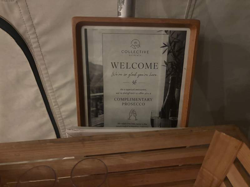 A framed welcome sign at Collective Retreats