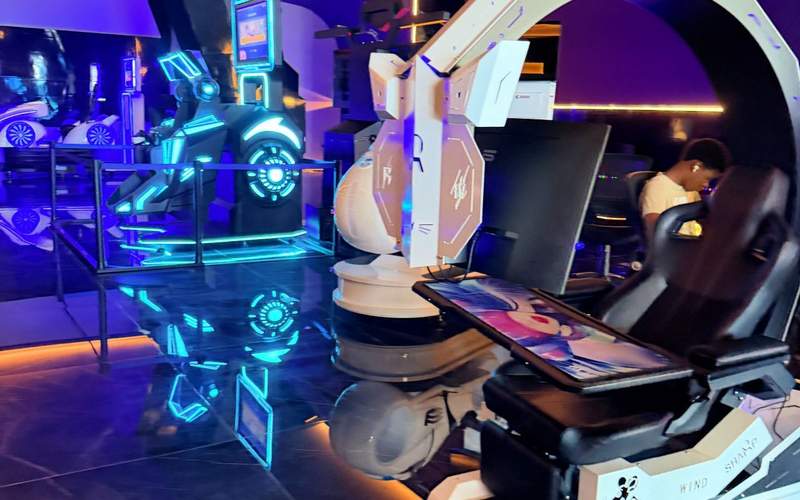 Virtual reality arcade and gaming center at Princess Grand Jamaica featuring VR simulators, racing games, and high-tech entertainment for kids and teens.