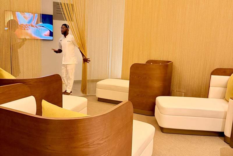 Male spa attendant looking into relaxation room at Princess Grand Jamaica resort.