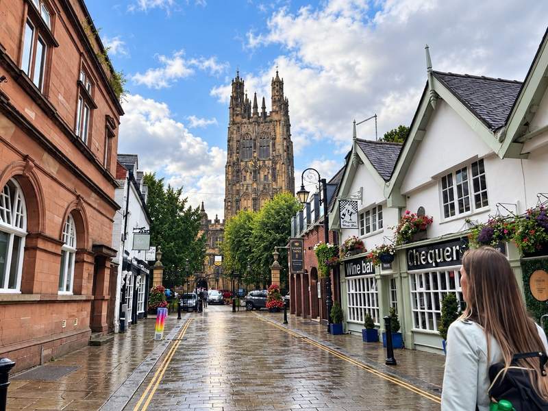 St Giles Church rising above a street in central Wrexham