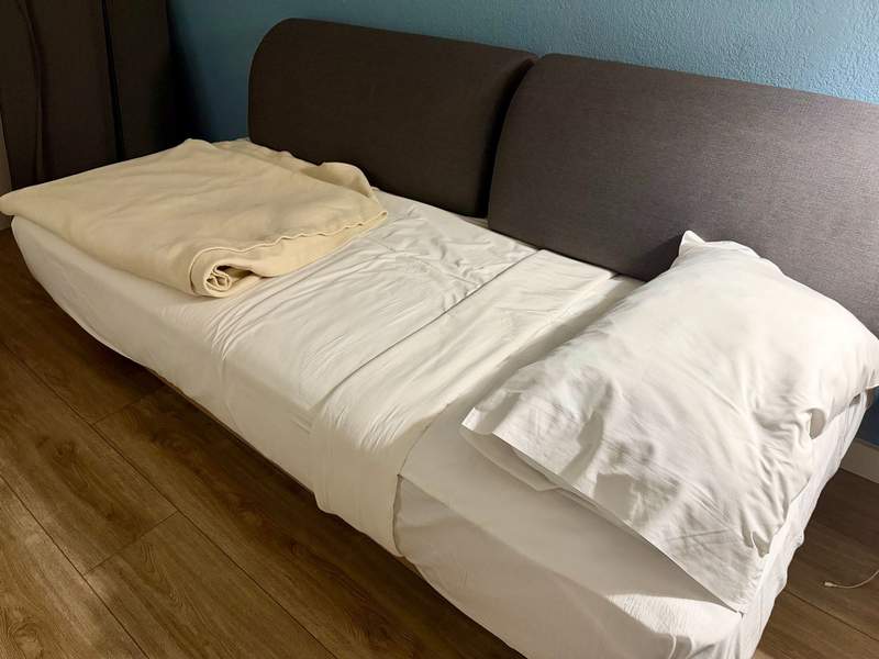 In-room couch made into a single bed.