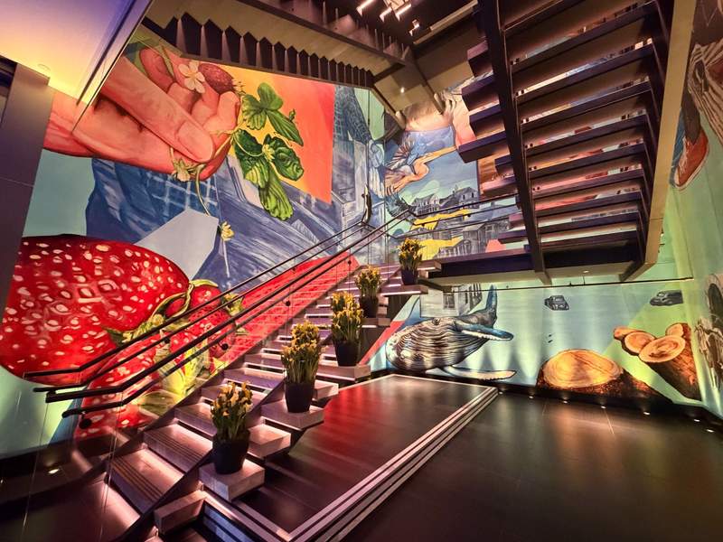 Brightly colored mural fills the stairwell of the W Bellevue.