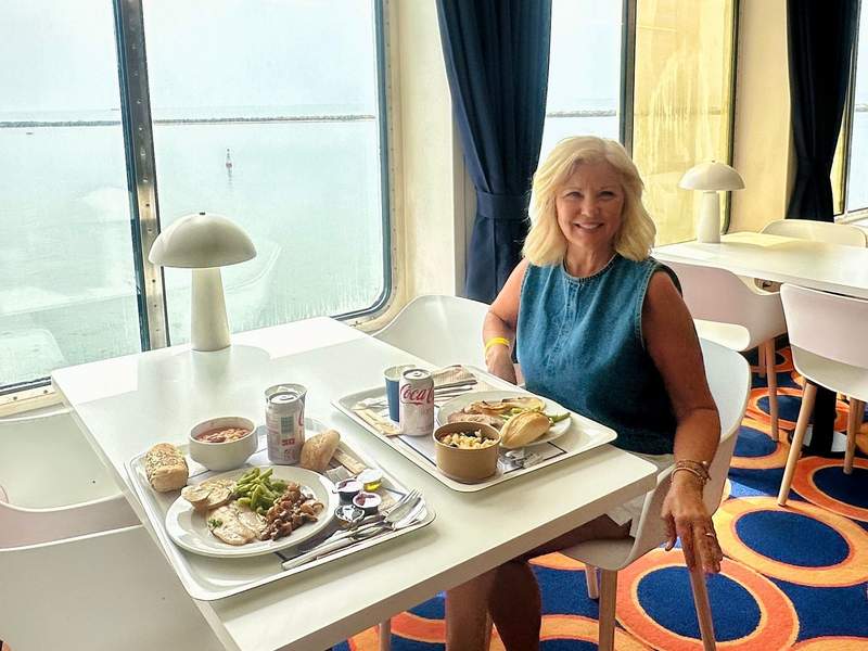 Woman eating a buffet meal aboard the ferry to Tenerife.