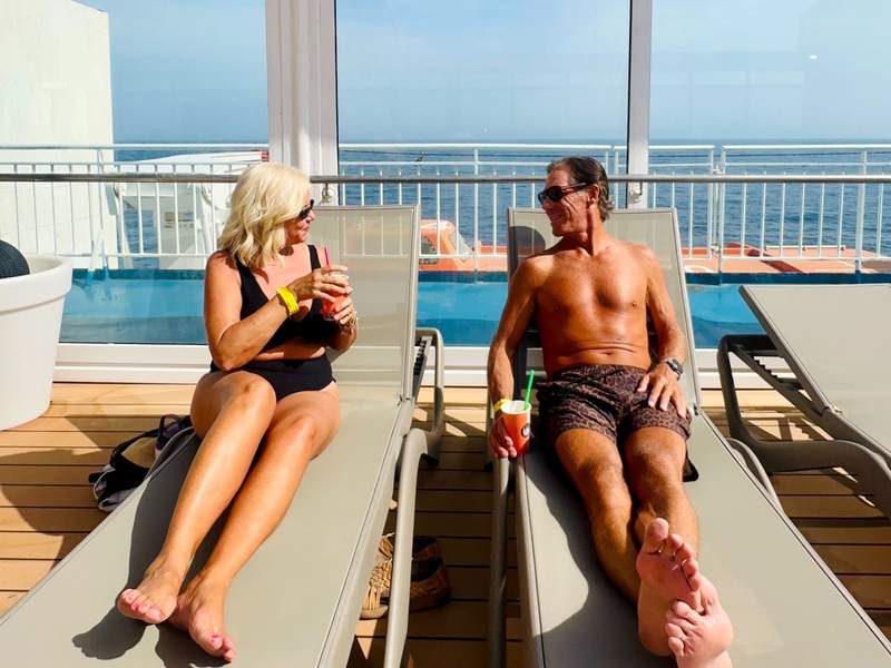 Couple relaxing on the Buenavista Express ferry sun deck.