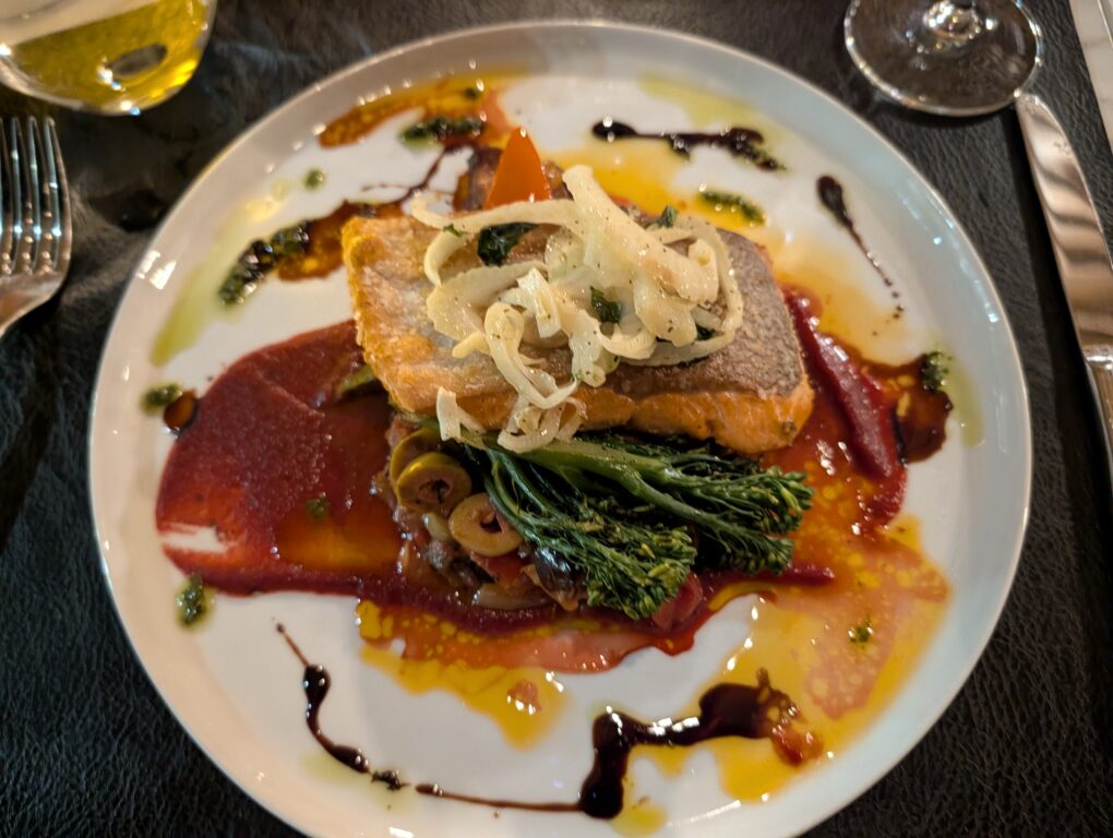 A while plate piled high with salmon and vegetables at Park 15 Bistro at Watermark Beach Resort in Canada's Osoyoos wine region
