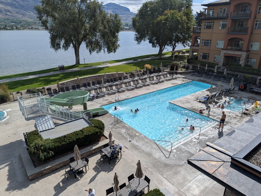 a bird's eye view of the family pool and water slide at the Watermark Beach Resort in Osoyoos BC