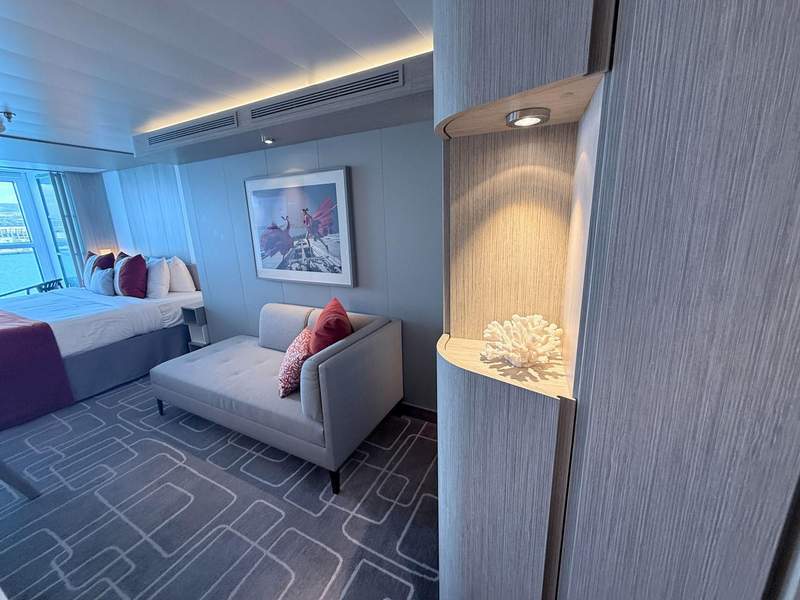 Celebrity Ascent stateroom with bed, sofa and ocean view