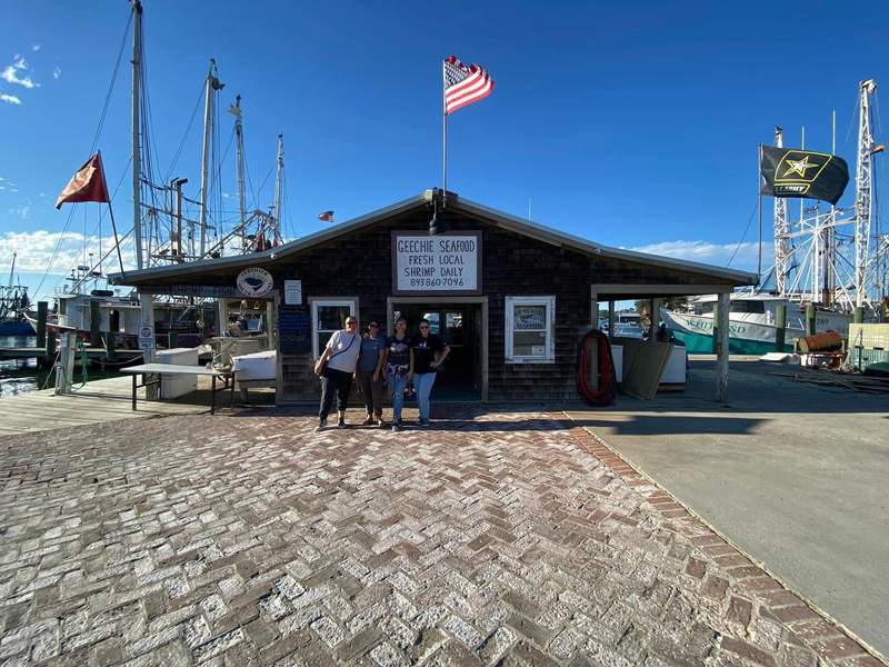 Geechie Seafood and fishing boats and wooden docks along Shem Creek in Mount Pleasant.