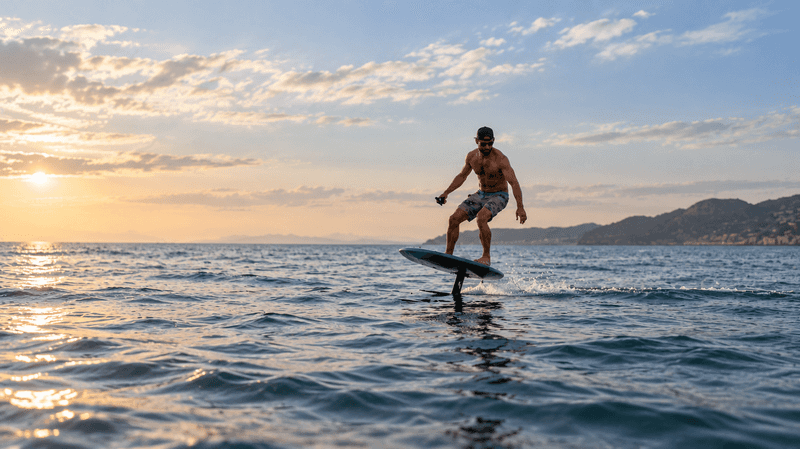 A man rides an eFoil board above calm ocean water at Grassy Flats Resort & Beach Club in the Florida Keys.