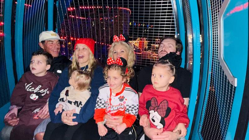 Grandparents, parents and grandchildren ride Mickey's Pixar Pal-A-Round together at Disney California Adventure.