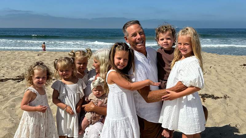 Grandparents surrounded by grandchildren on a sunny California beach during a multigenerational family vacation.We've rented beach houses for family trips all over California, and sometimes all you really need is sand, grandkids and time together. Photo credit: Shelly Peterson