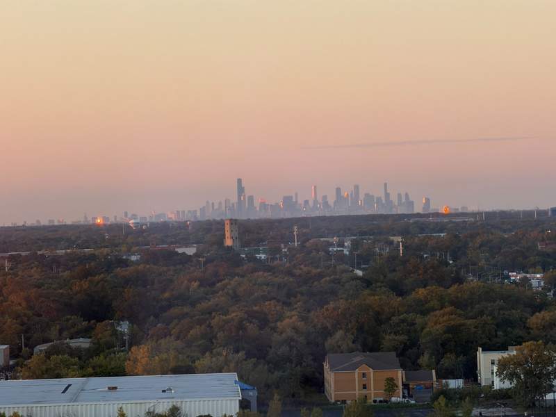 Panoramic sunset view of the Chicago skyline seen in the distance from Wind Creek Chicago Southland.