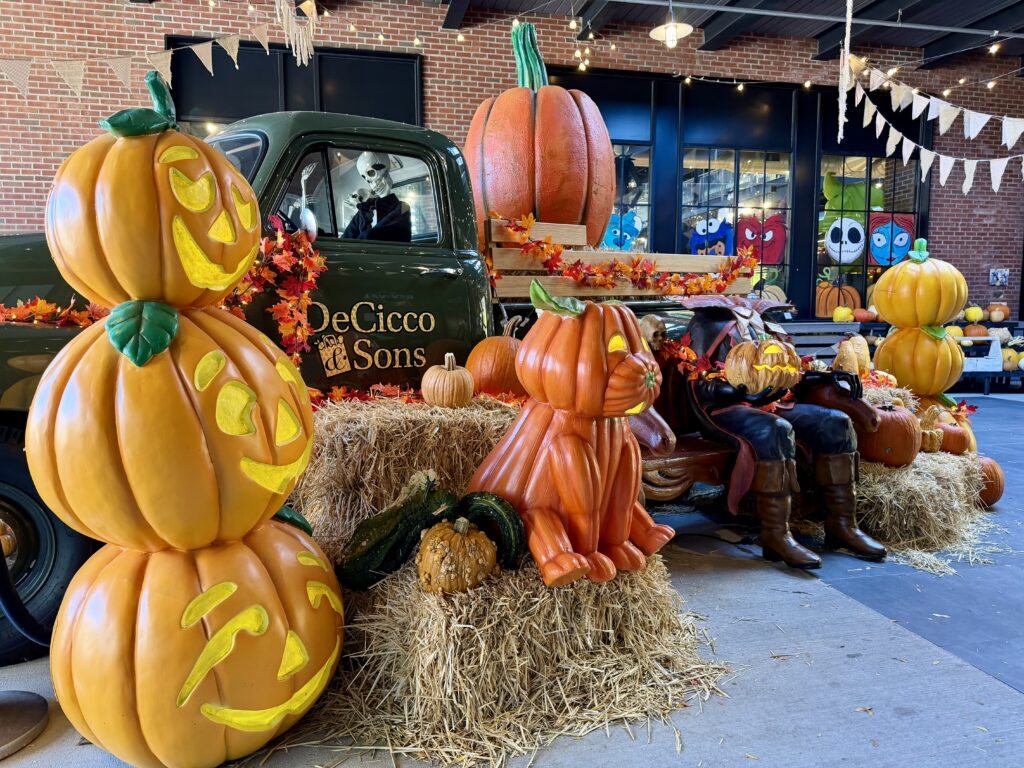 Entrance to DeCicco and Sons grocery store near Sleepy Hollow, decorated for Halloween with pumpkins and hay bales
